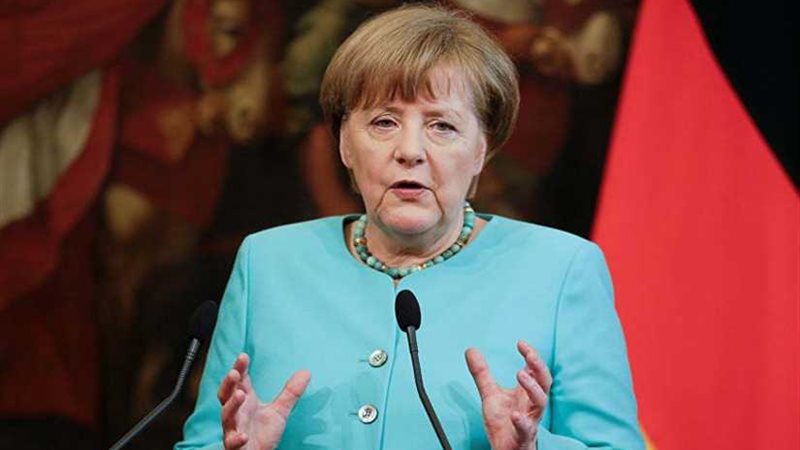 ميركل تجتمع مع ماي