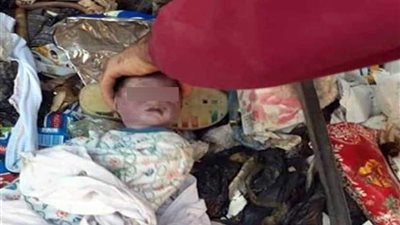 العثور على جثة طفل حديث الولادة في القمامة بالوراق (صور)