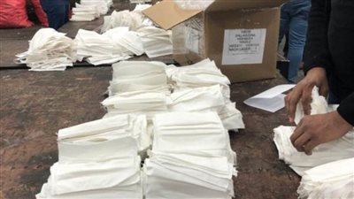 إحباط تهريب أقمشة تستخدم في تصنيع الكمامات بميناء القاهرة الجوي