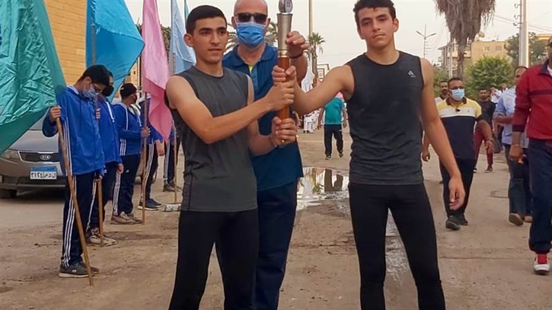 أثناء تسليم شعلة