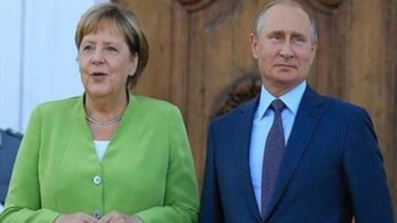 بوتين وميركل