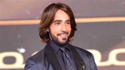 مصمم الأزياء 