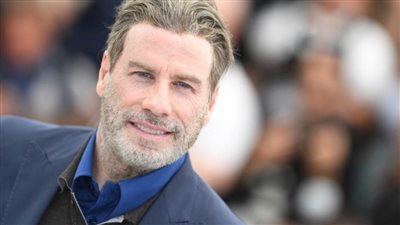 تعليق روجينا على صورتها مع جون ترافولتا 